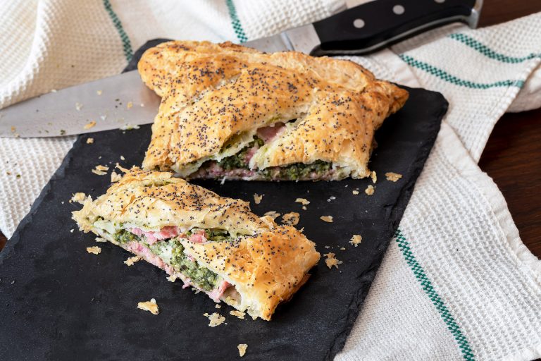 Slices,Of,Sausage,And,Broccoli,Roll,On,A,Slate,Plate