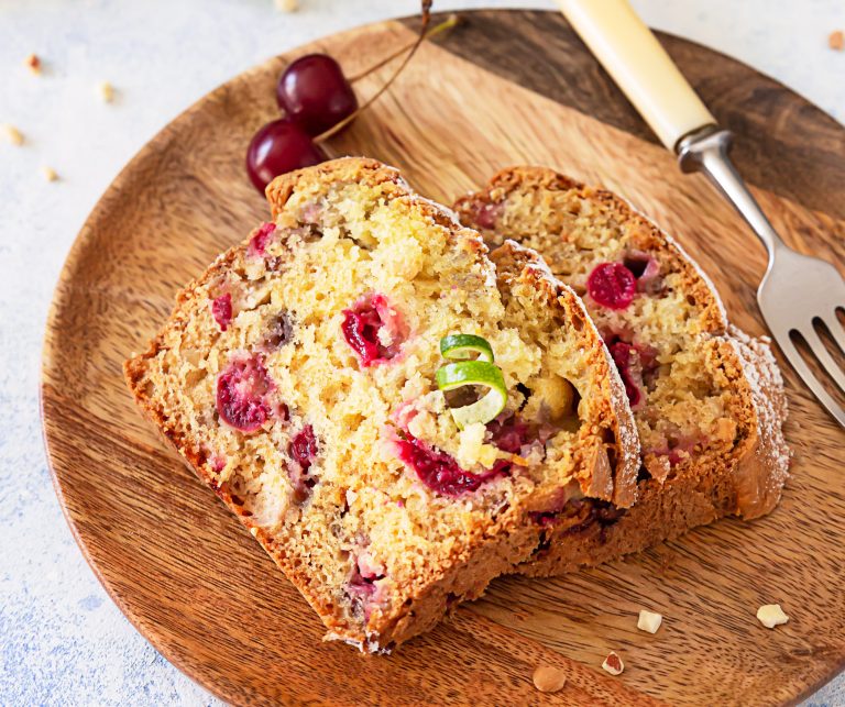 Homemade,Sweet,Cherry,Loaf,Cake,With,Nuts,On,Wooden,Plate