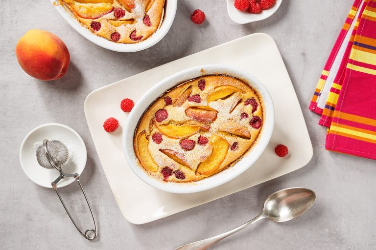 Traditional,French,Pie,Clafoutis,With,Fresh,Summer,Peaches,And,Raspberry