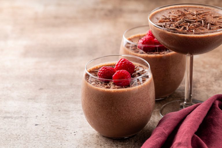 Homemade,Chocolate,Mousse,Decorated,With,Raspberries,And,Dark,Chocolate,Sprinkles