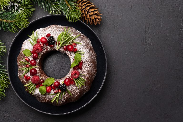 Christmas,Cake,Decorated,With,Pomegranate,Seeds,,Cranberries,And,Rosemary
