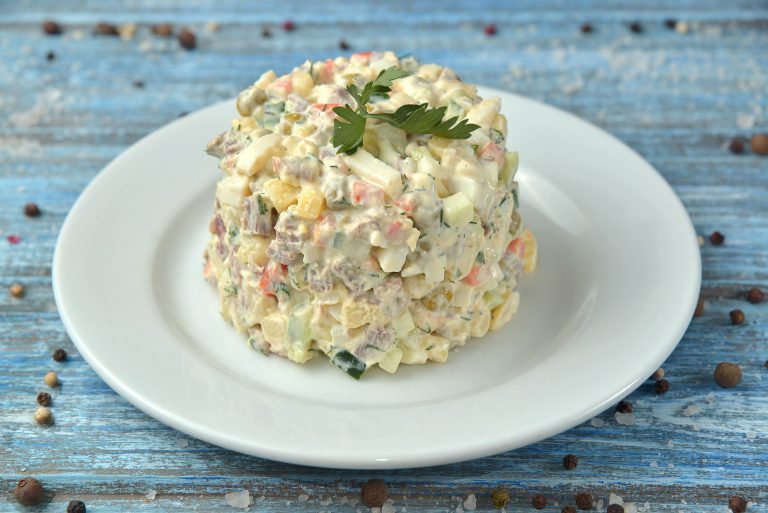 Fresh,Salad,On,Wooden,Table,With,Ingredients,On,Background