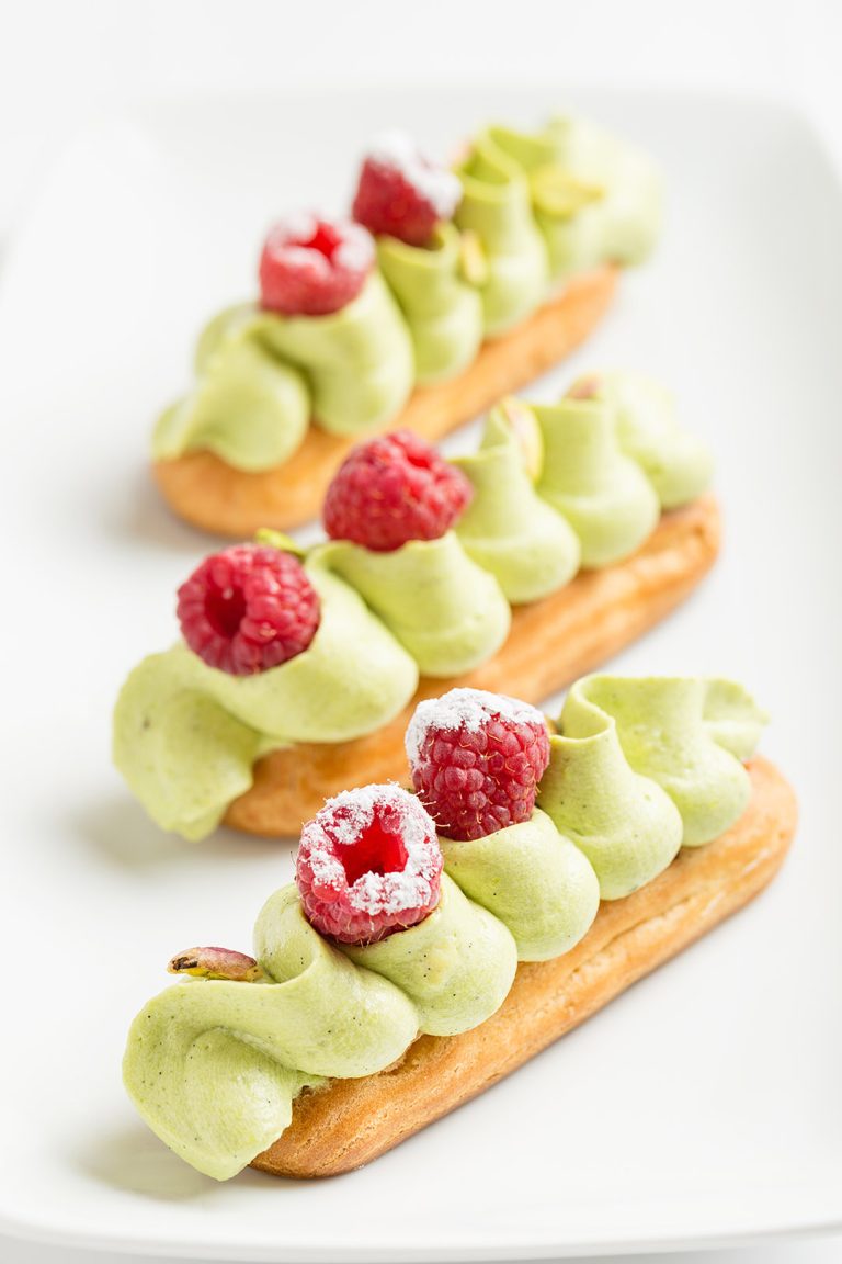 Traditional,French,Eclair,With,Pistachio,Cream,And,Strawberries,On,White