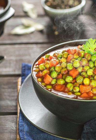 Arabic Cuisine; Middle Eastern traditional peas and carrot stew. A delicious vegan meal with peas and carrot doused in aromatic tomato sauce. Served with white rice and oriental pickles.