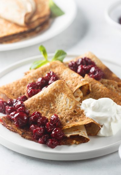 Pancakes with cherries and cream