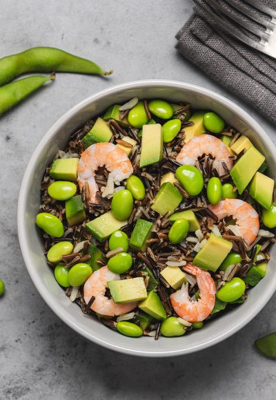 Shrimp salad with black rice, edamame beans, avocado. Healthy nutrition with seafood