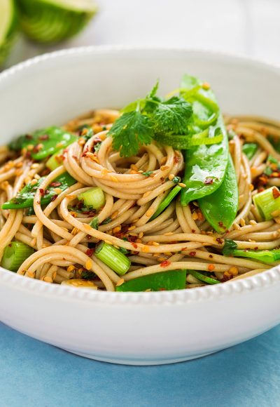 Sesame spaghetti with edamame beans and spring onions, chilli flakes