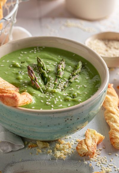 Healthy creamy asparagus soup as healthy diet for spring. Veggie soup made of vegetables.