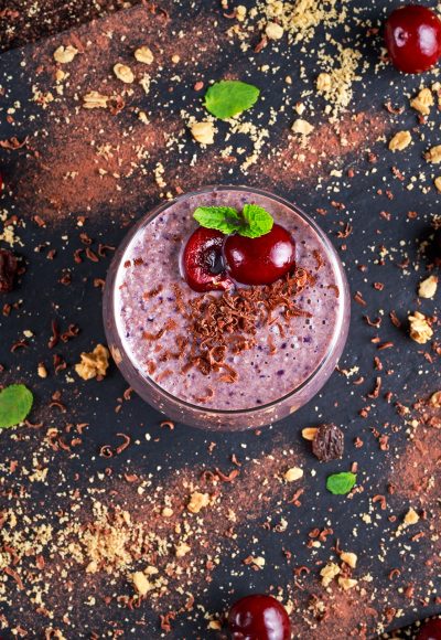 Healthy Breakfast Chocolate, berry and oats Smoothie decorated with cherry